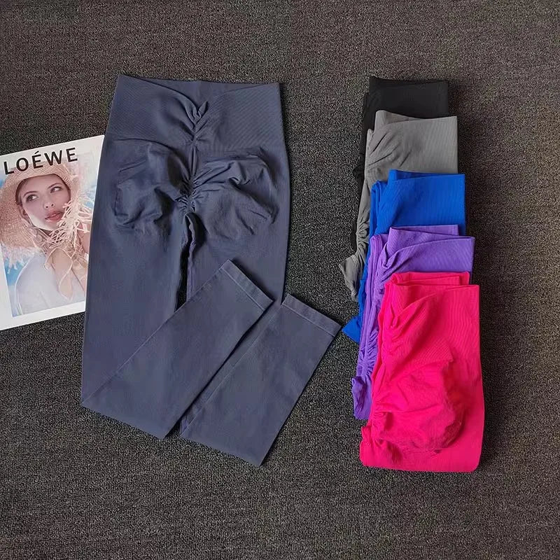 Breathable gym leggings in multiple colors displayed with fashion magazine for active wardrobe