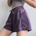 Stylish purple breathable gym shorts for women with mesh panels for improved airflow