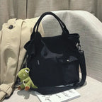 Stylish black casual canvas tote bag for women with durable handles and exterior pockets