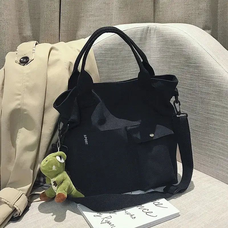Stylish black casual canvas tote bag for women with durable handles and exterior pockets