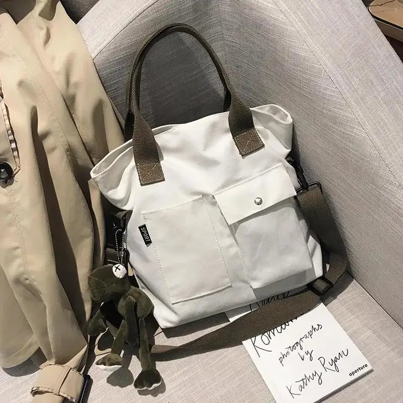 Stylish casual canvas tote bag for women with adjustable straps and front pocket design