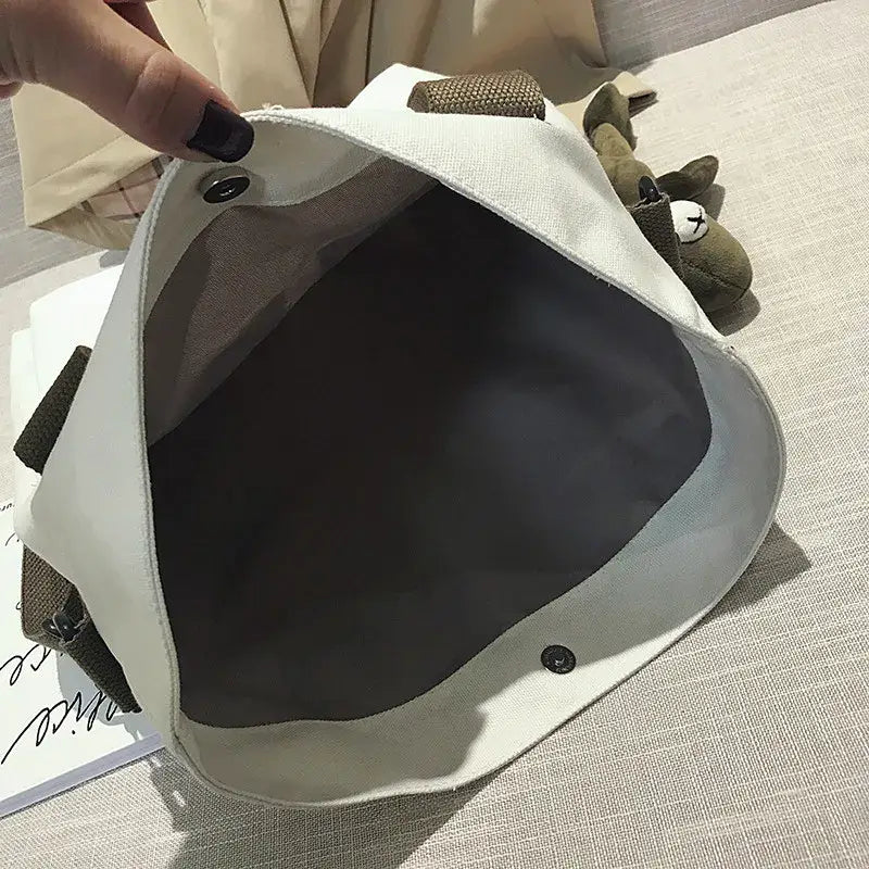 Interior view of a casual canvas tote bag for women with spacious compartment and snap closure