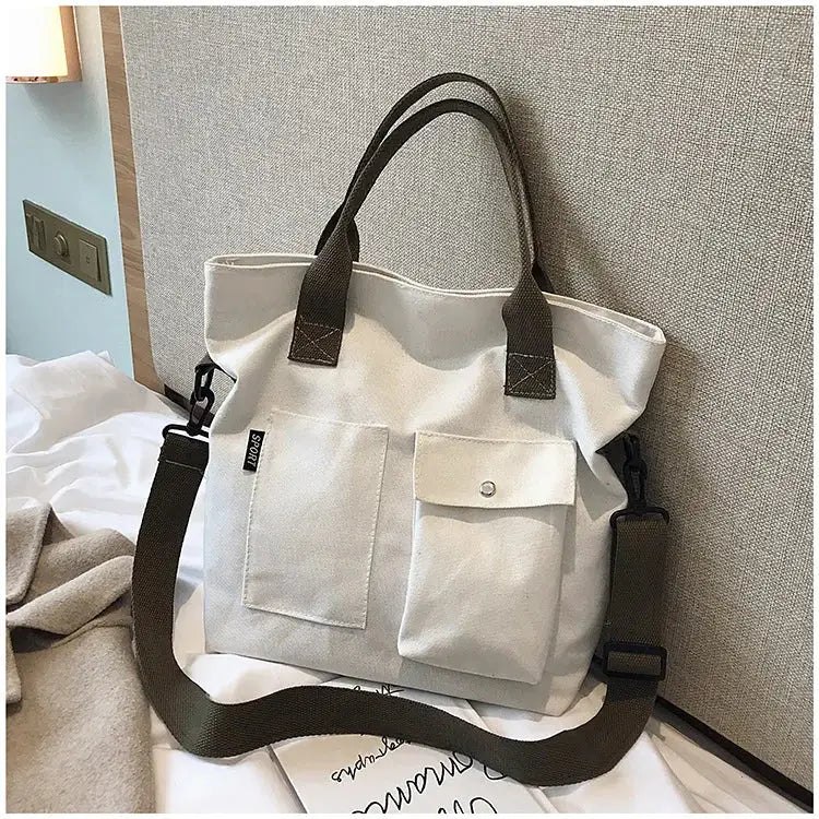 Stylish casual canvas tote bag for women with multiple pockets and adjustable strap