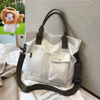 Stylish casual canvas tote bag for women with sturdy straps and front pockets for easy access