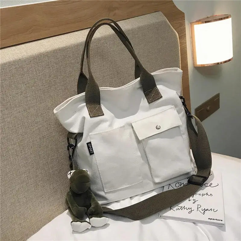 Casual canvas tote bag for women in white with front pockets and detachable strap
