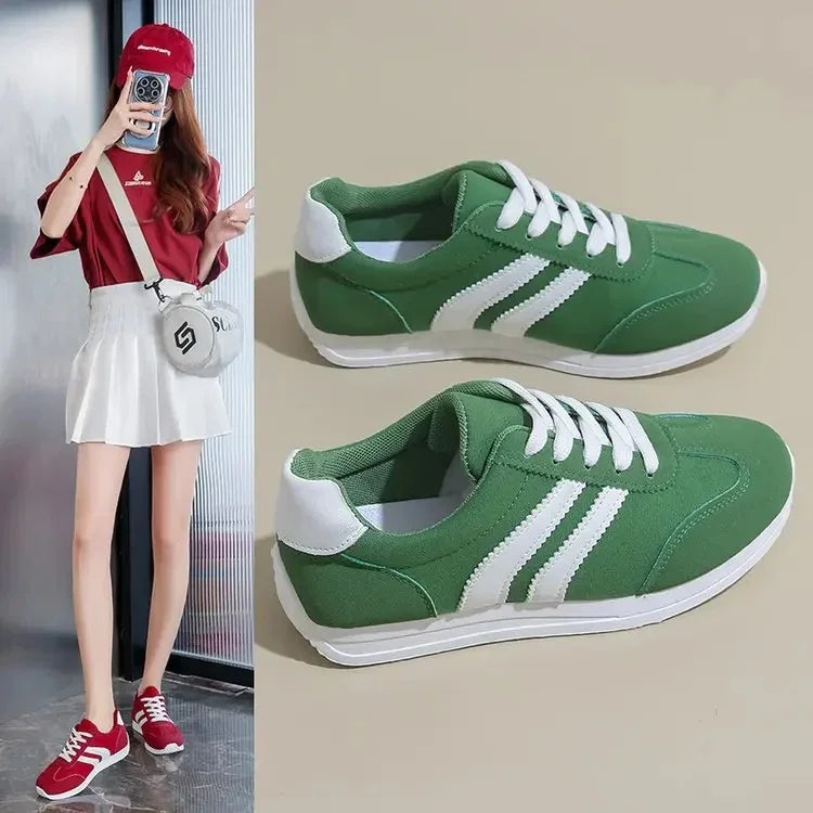 Green casual slip on sneakers with white stripes and laces from The Lady's Haven Boutique
