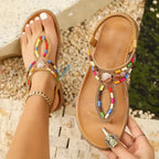 Colorful bohemian beaded sandals flat heel sandals from The Lady's Haven Boutique shown on foot and held in hand