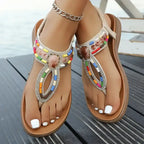 Colorful bohemian beaded sandals flat heel from The Lady's Haven Boutique on feet outdoor