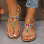 The Lady's Haven Boutique comfortable flat beach flip flops with colorful jeweled straps on feet