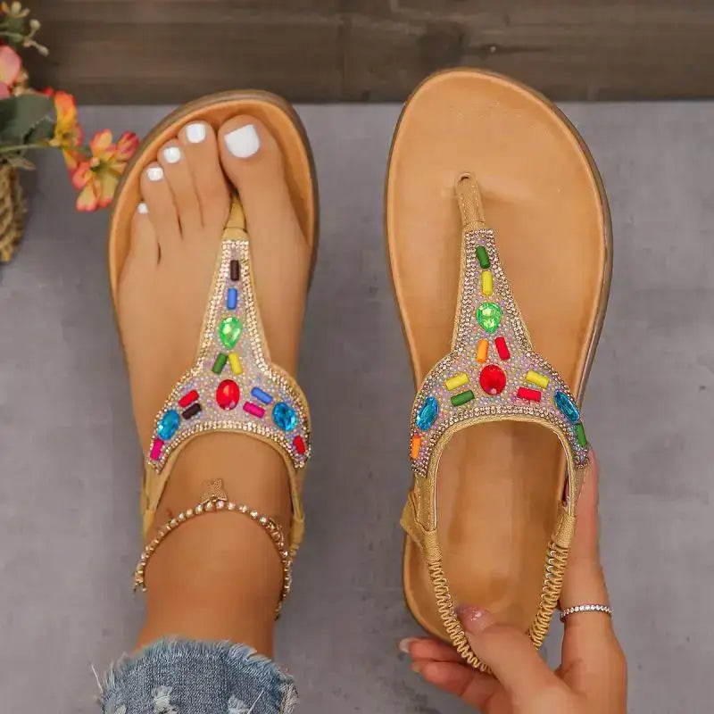 The Lady's Haven Boutique comfortable flat beach flip flops with colorful gemstone design on tan flat heel sandals
