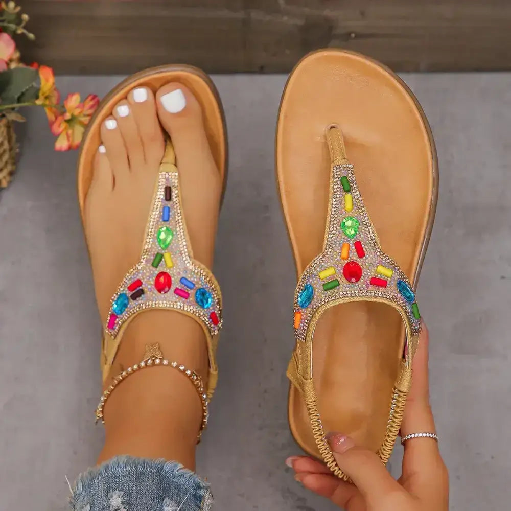 The Lady's Haven Boutique comfortable flat beach flip flops embellished with colorful beads on tan flat heel sandals