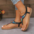 The Lady's Haven Boutique comfortable flat beach flip flops with black straps and colorful beads