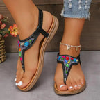 The Lady's Haven Boutique comfortable flat beach flip flops with colorful beaded design on black straps