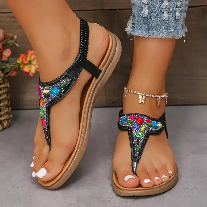 The Lady's Haven Boutique comfortable flat beach flip flops with colorful beaded design on black straps