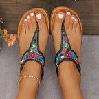 The Lady's Haven Boutique comfortable flat beach flip flops with colorful beaded design on tan footbed