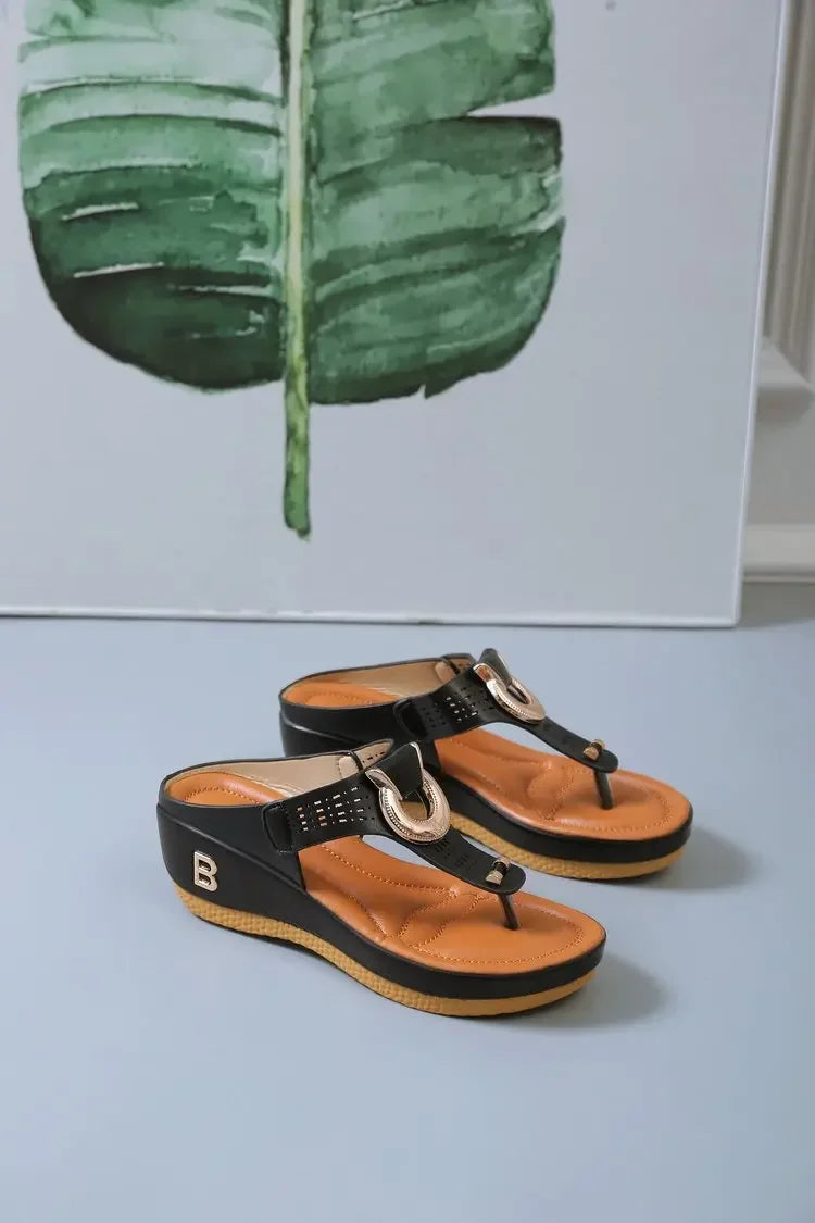 Comfortable open toe beach sandals with black straps and tan cushioned sole from The Lady's Haven Boutique