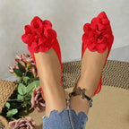 Red flat heel sandals with large flower decoration from The Lady's Haven Boutique comfortable pointed toe summer shoes
