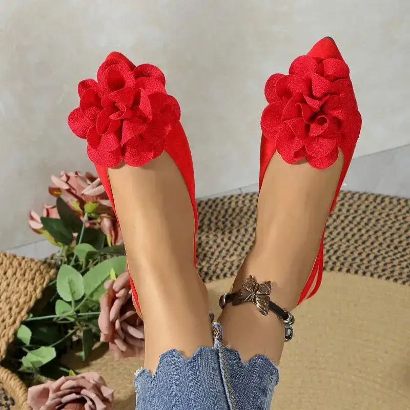 Red flat heel sandals with large flower decoration from The Lady's Haven Boutique comfortable pointed toe summer shoes