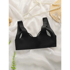 Black comfortable steel ring bra for women with wide straps laid on white fabric background