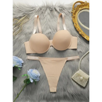 Beige comfortable steel ring lingerie for women set with bra and thong on gray fur background