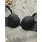 Black comfortable steel ring lingerie for women laid flat on a gray fur surface showcasing smooth padded cups