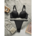 Black comfortable steel ring lingerie for women set with bra and thong on fur background