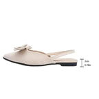 The Lady's Haven Boutique flat heel sandals featuring comfortable summer pointed toe shoes in beige with decorative bow