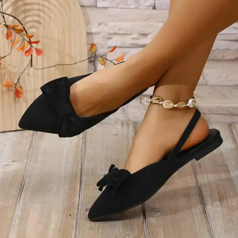 Black flat heel sandals with bow detail by The Lady's Haven Boutique comfortable summer pointed toe shoes