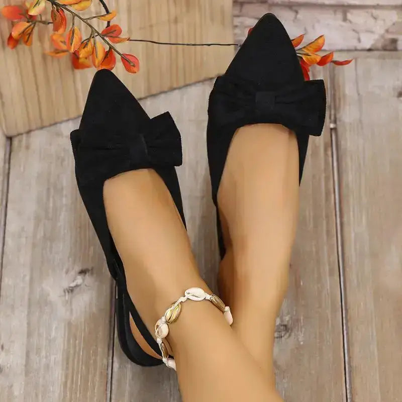 Black flat heel sandals with bow detail for comfortable summer pointed toe shoes