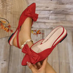 Red flat heel sandals with bow detail from The Lady's Haven Boutique, comfortable summer pointed toe shoes