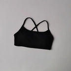 Black cross back sports bra from The Lady's Haven Boutique featuring a stylish design for activewear