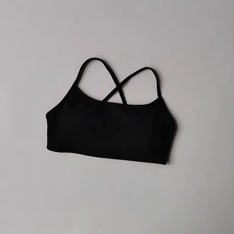 Black cross back sports bra from The Lady's Haven Boutique featuring a stylish design for activewear