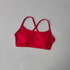 Bright red cross back sports bra designed for comfort and support during workouts