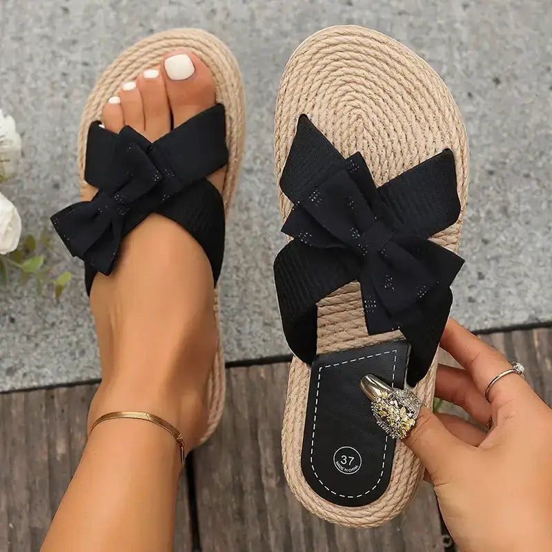 Black flat heel cross strap comfort sandals with bow detail from The Lady's Haven Boutique