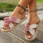 The Lady's Haven Boutique flat heel cross strap comfort sandals with pink bow detail