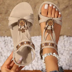 The Lady's Haven Boutique cross strap soft sole sandals in beige with floral accents and ankle elastic strap