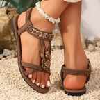 Brown cross strap soft sole sandals with floral details and flat heel from The Lady's Haven Boutique