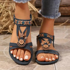 The Lady's Haven Boutique cross strap soft sole sandals with floral embellishments on flat heel