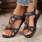 The Lady's Haven Boutique cross strap soft sole sandals with decorative floral accents on flat heel