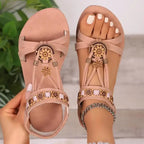 The Lady's Haven Boutique cross strap soft sole sandals in soft pink with floral embellishments