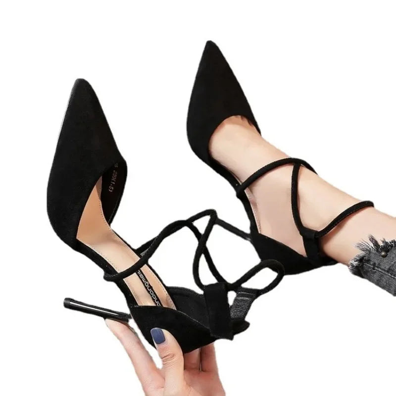 Black cross strap suede high heels with pointed toes and stiletto heels from The Lady's Haven Boutique