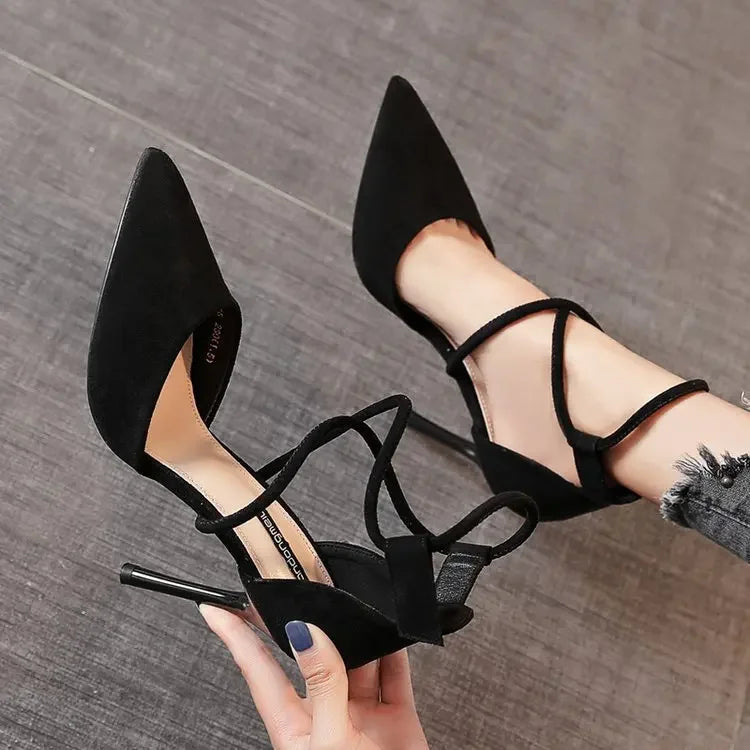 Black cross strap suede high heels with pointed toes and slim stiletto heels from The Lady's Haven Boutique