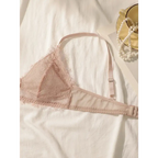 Delicate lace intimate set for ladies featuring a soft pink lace bralette with adjustable straps