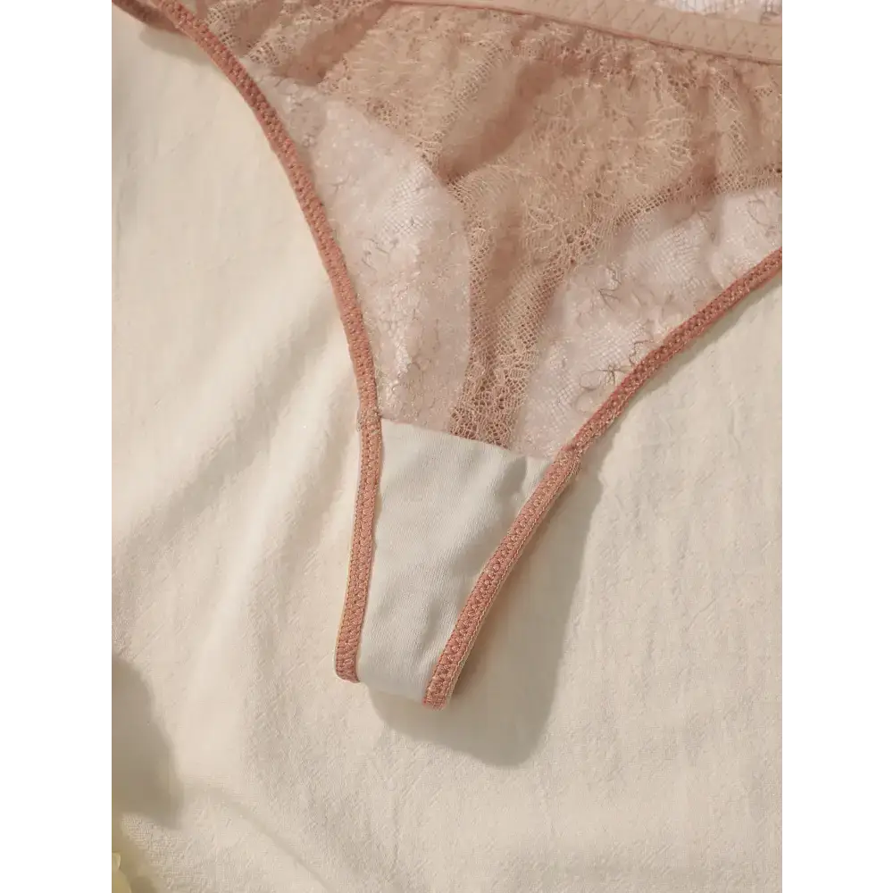 Delicate lace intimate set for ladies featuring sheer pink lace fabric and soft trim edges