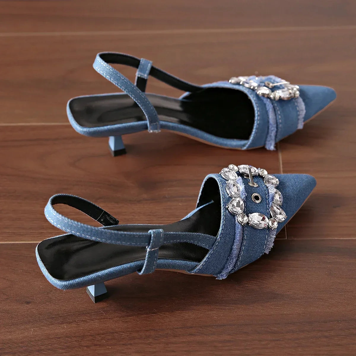 Blue pointed toe stiletto sandals with jeweled buckle and slingback straps from The Lady's Haven Boutique