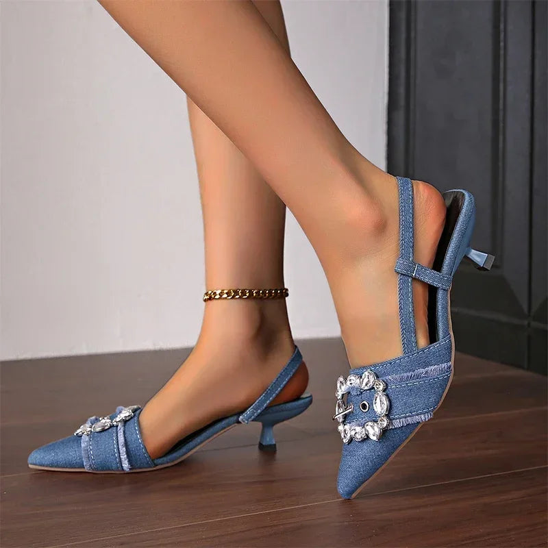 Blue denim pointed toe stiletto sandals with decorative buckle details from The Lady's Haven Boutique