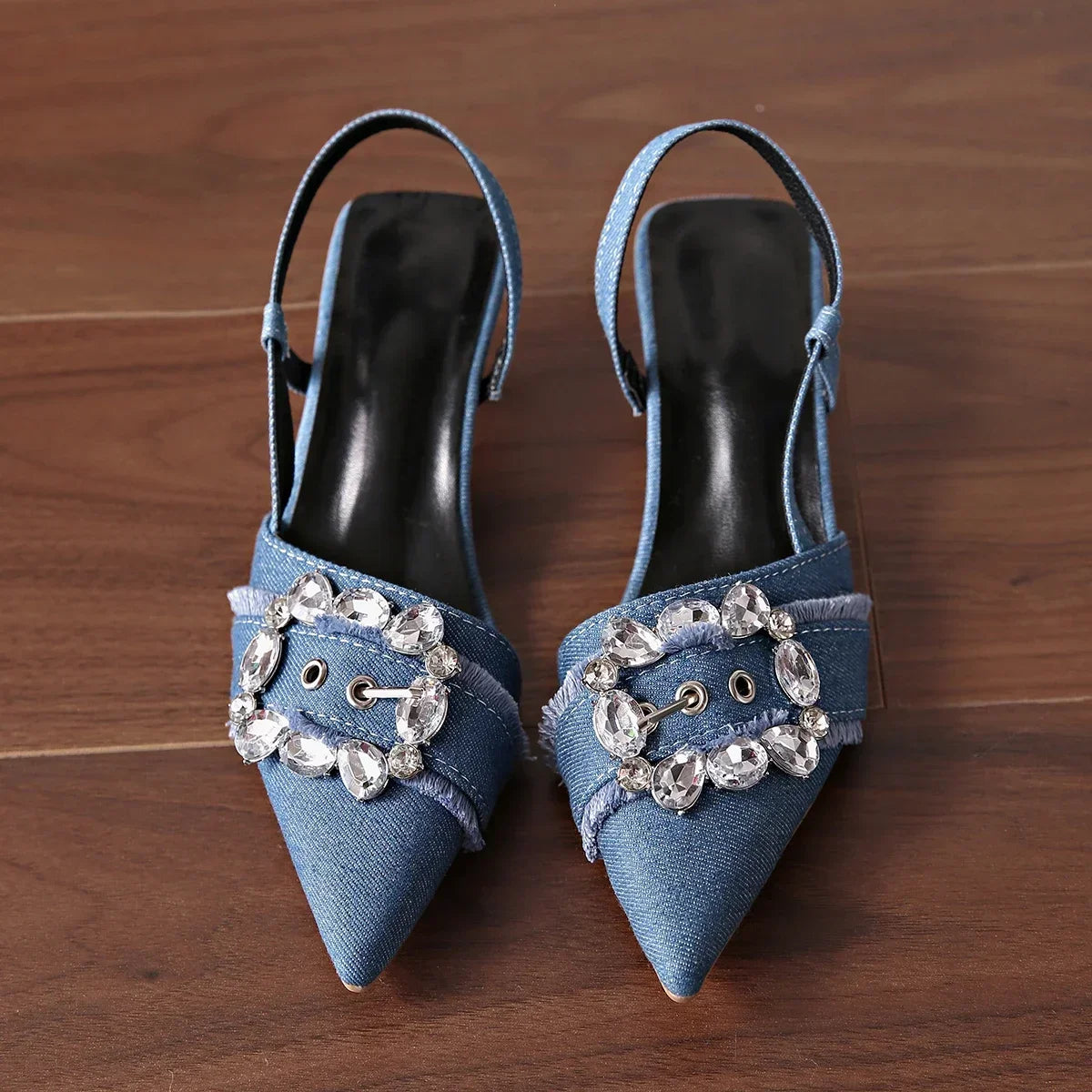 Blue denim pointed toe stiletto sandals with crystal buckle embellishments from The Lady's Haven Boutique