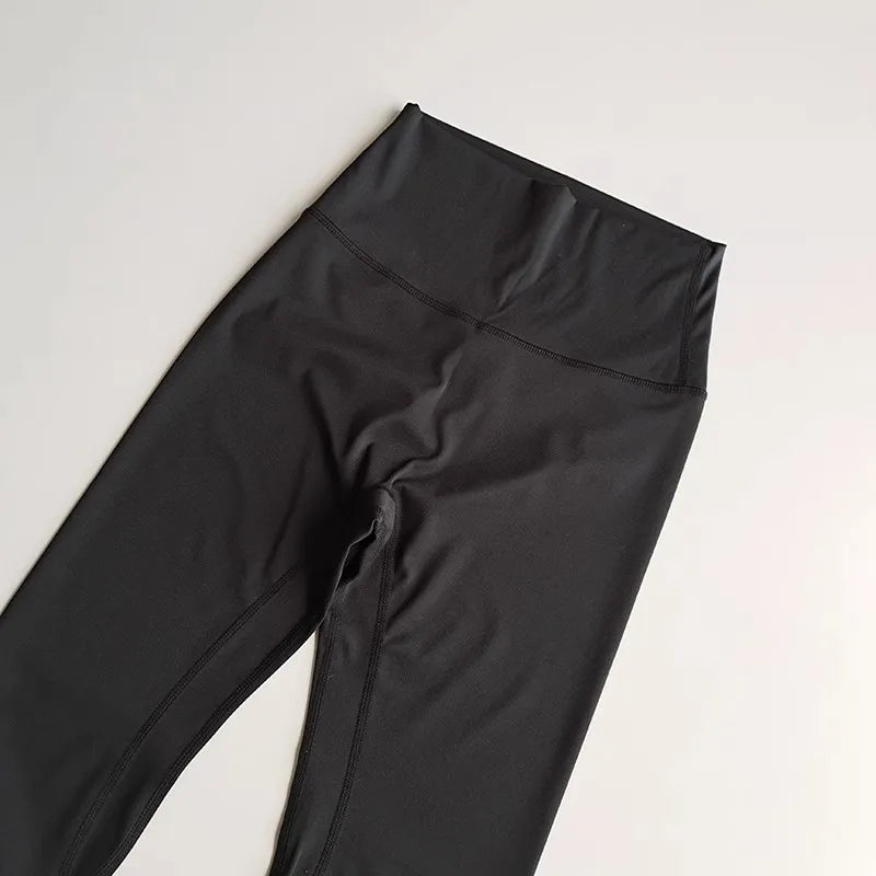 Black elastic fitness leggings for women with a high waistband for comfort and flexibility