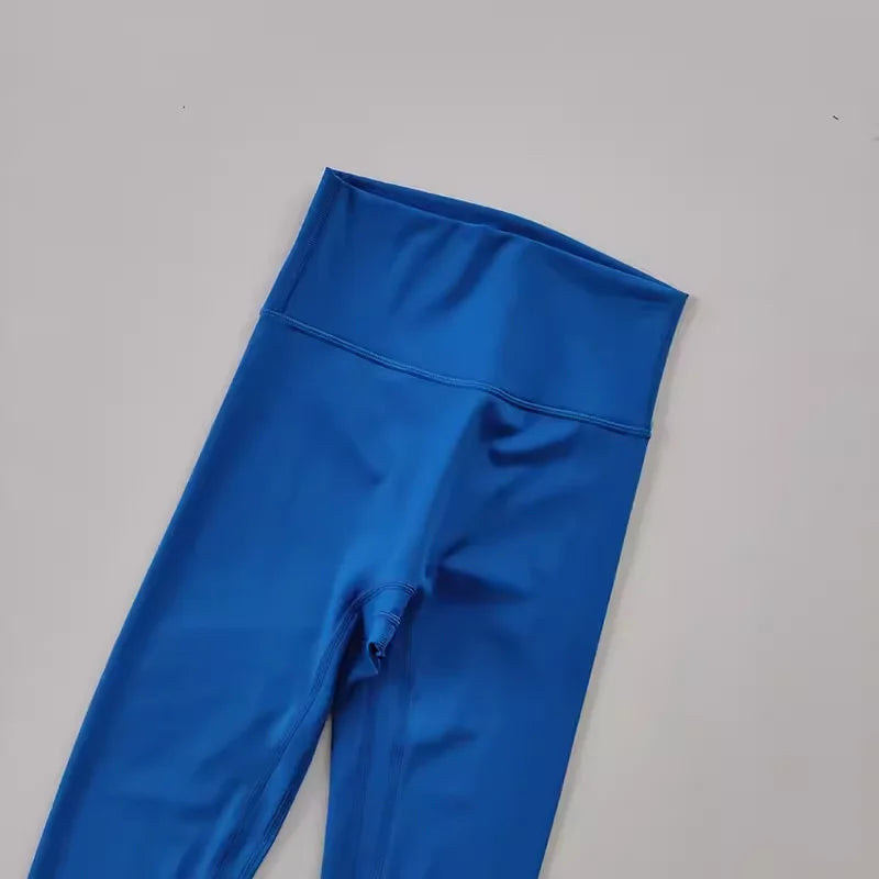Bright blue elastic fitness leggings for women with a comfortable high waistband