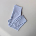 Light blue elastic fitness leggings for women with a comfortable waistband and breathable fabric